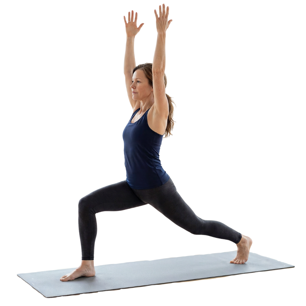 Woman in a navy tank top and dark leggings in Warrior I yoga pose with arms raised on a mat.