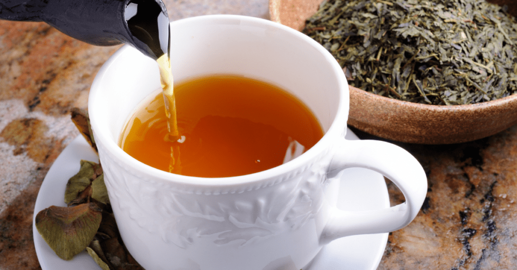 green tea being poured green tea being poured